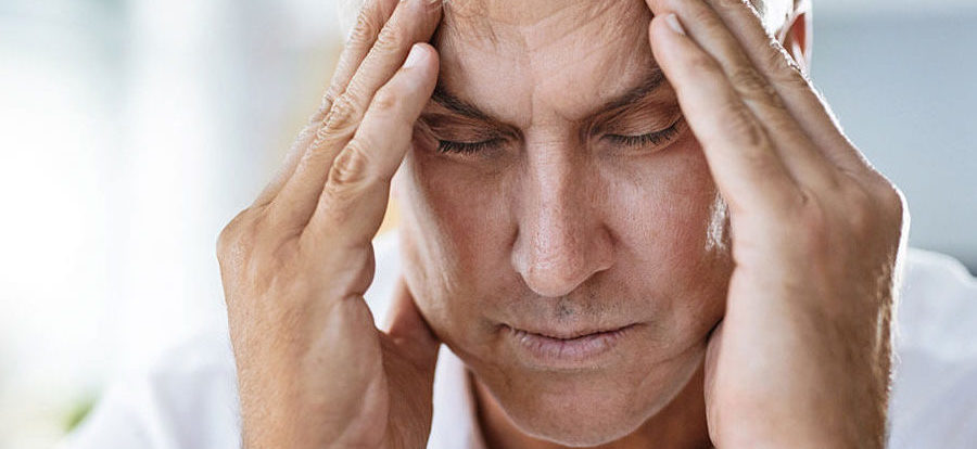 man holding head