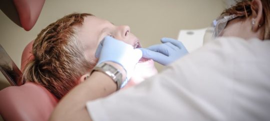 boy on dentist table